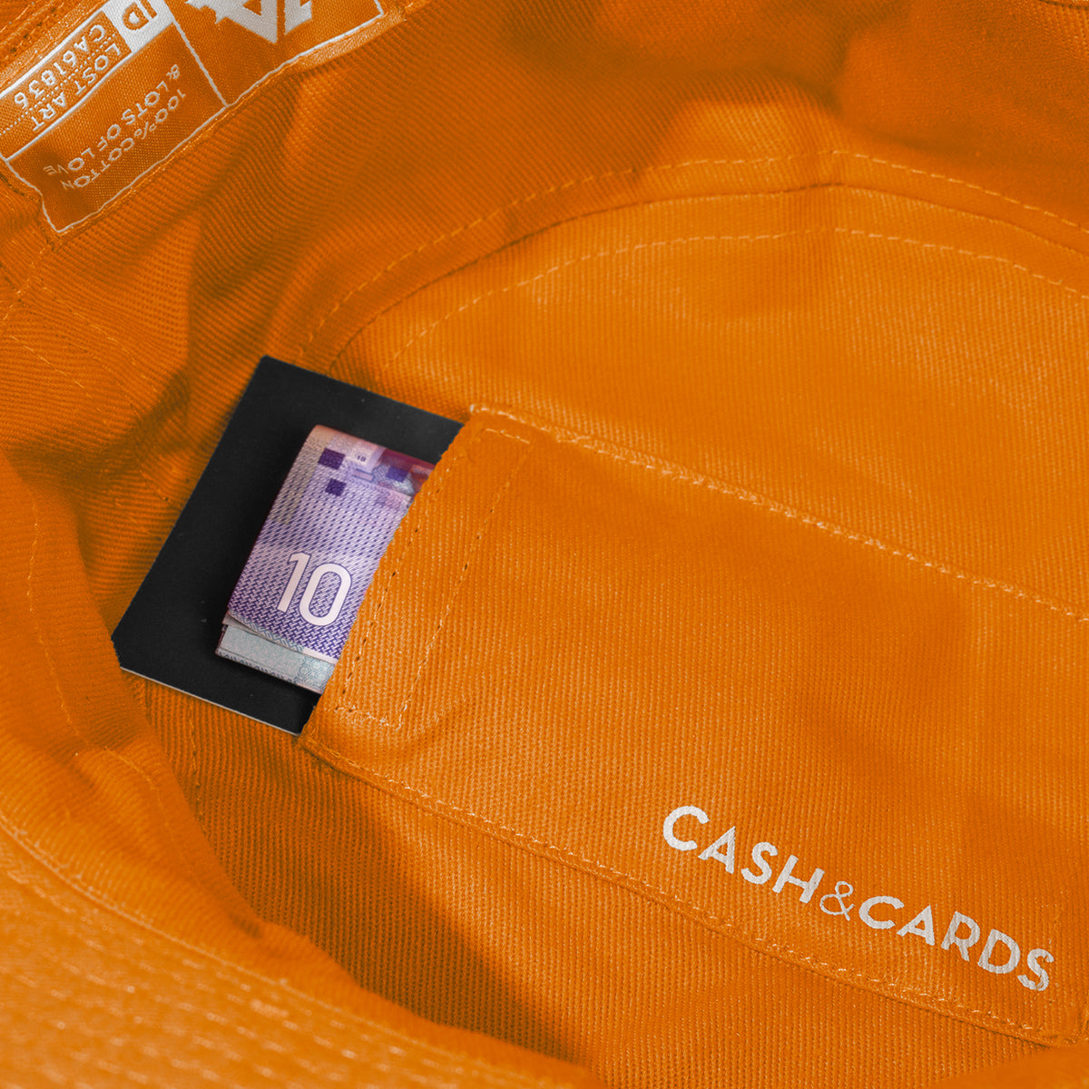 Lost Art Canada - green orange coloured bucket hat inside pocket view