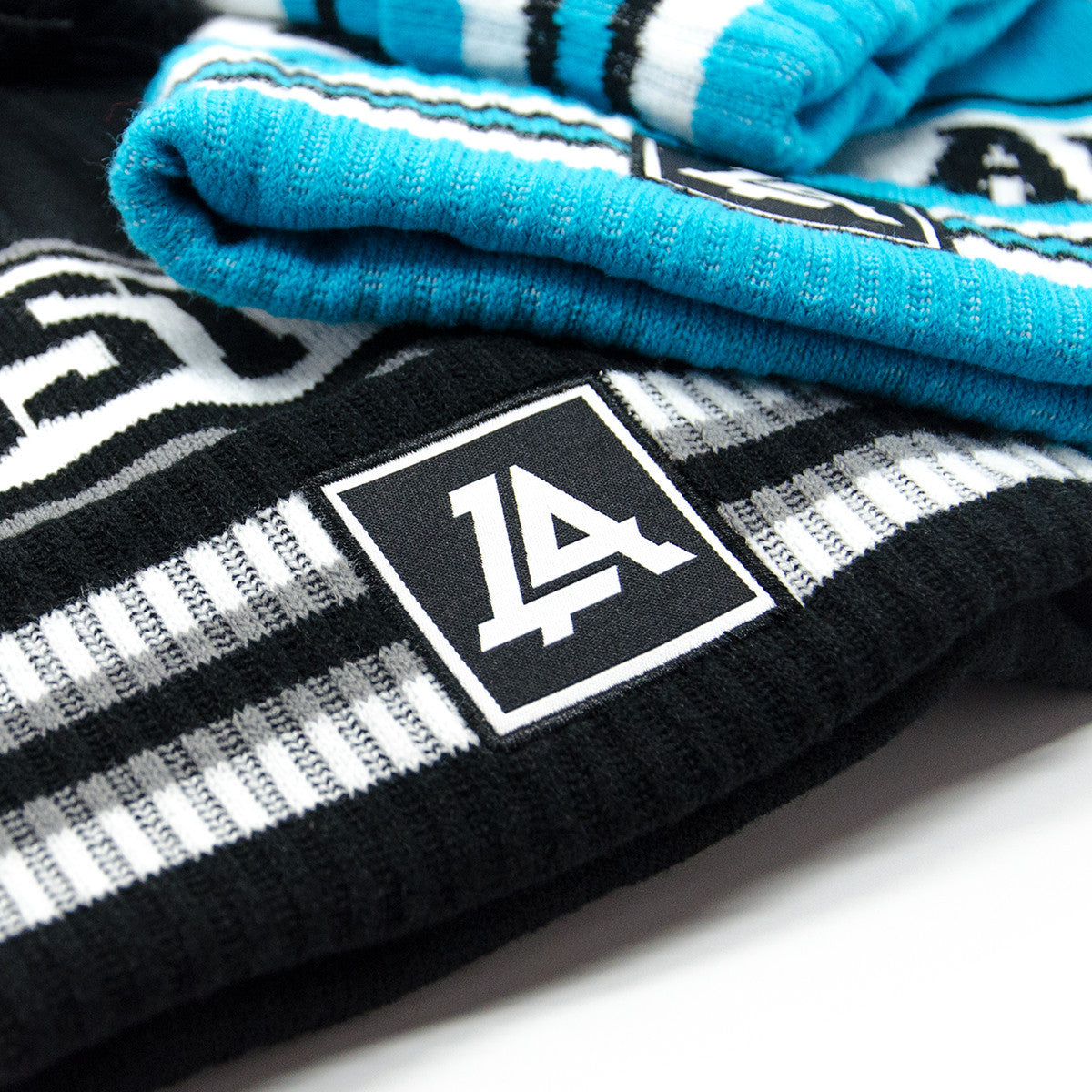Lost Art Canada - black and blue pompom winter toques