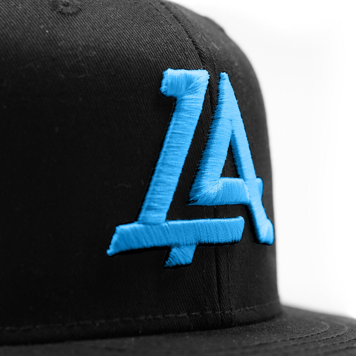 Lost Art Canada - blue logo black snapback hat close up