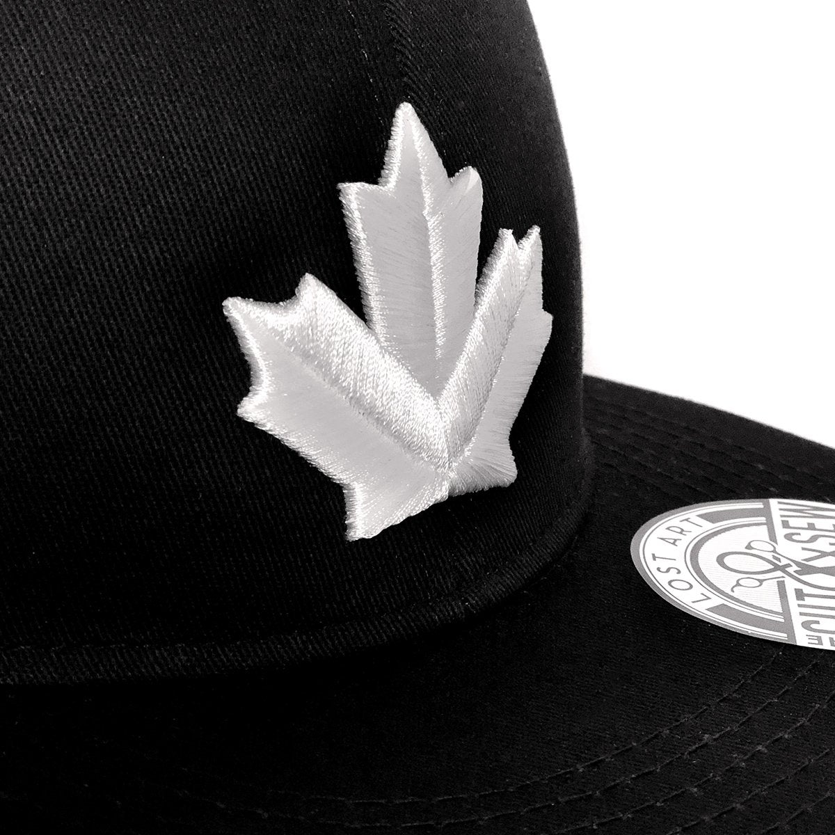 Lost Art Canada - white maple leaf black snapback hat close up