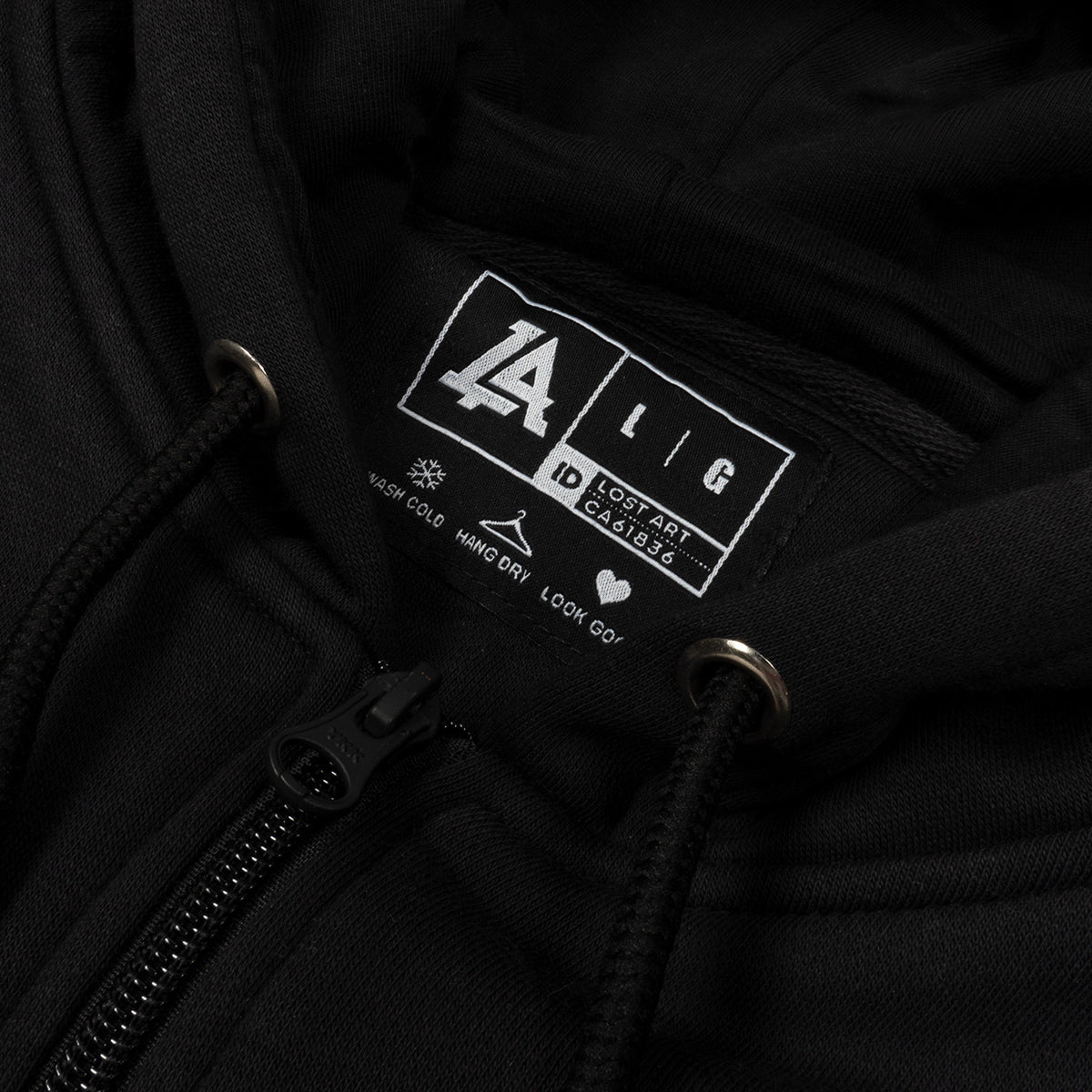 Lost Art Canada - black leisure suit sweatsuit sweatshirt inside tag view